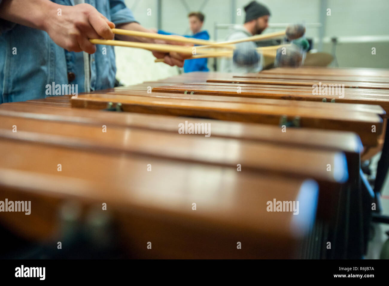 Musician in action with percussion instrument during a concert or