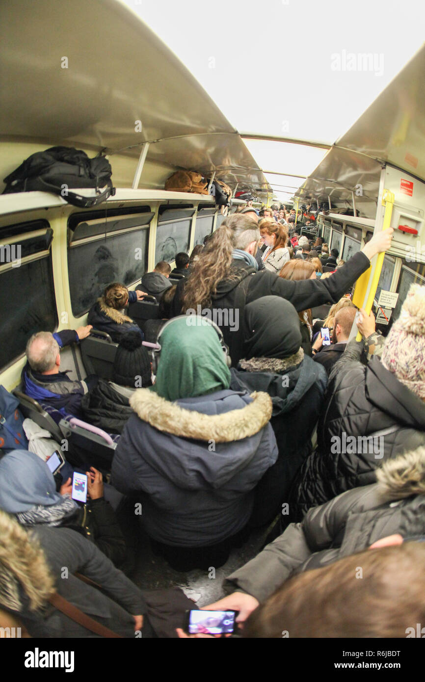 5 December 2018. Overcrowding on the 17:41 Northern Trains service between Manchester Victoria and Clitheroe in Lancashire. The rolling stock is a 2 carriage Pacer, a bus body welded onto a train chassis devised as a temporary measure 30 years ago (this service should have 4 carriages). The train was especially overcrowded as commuters were advised by Greater Manchester Police to use public transport due to the Manchester United V Arsenal match, and extra traffic for the Christmas Markets. The train's intermediate stops are Bolton and Blackburn. Credit: Phil Taylor/Alamy Live News Stock Photo