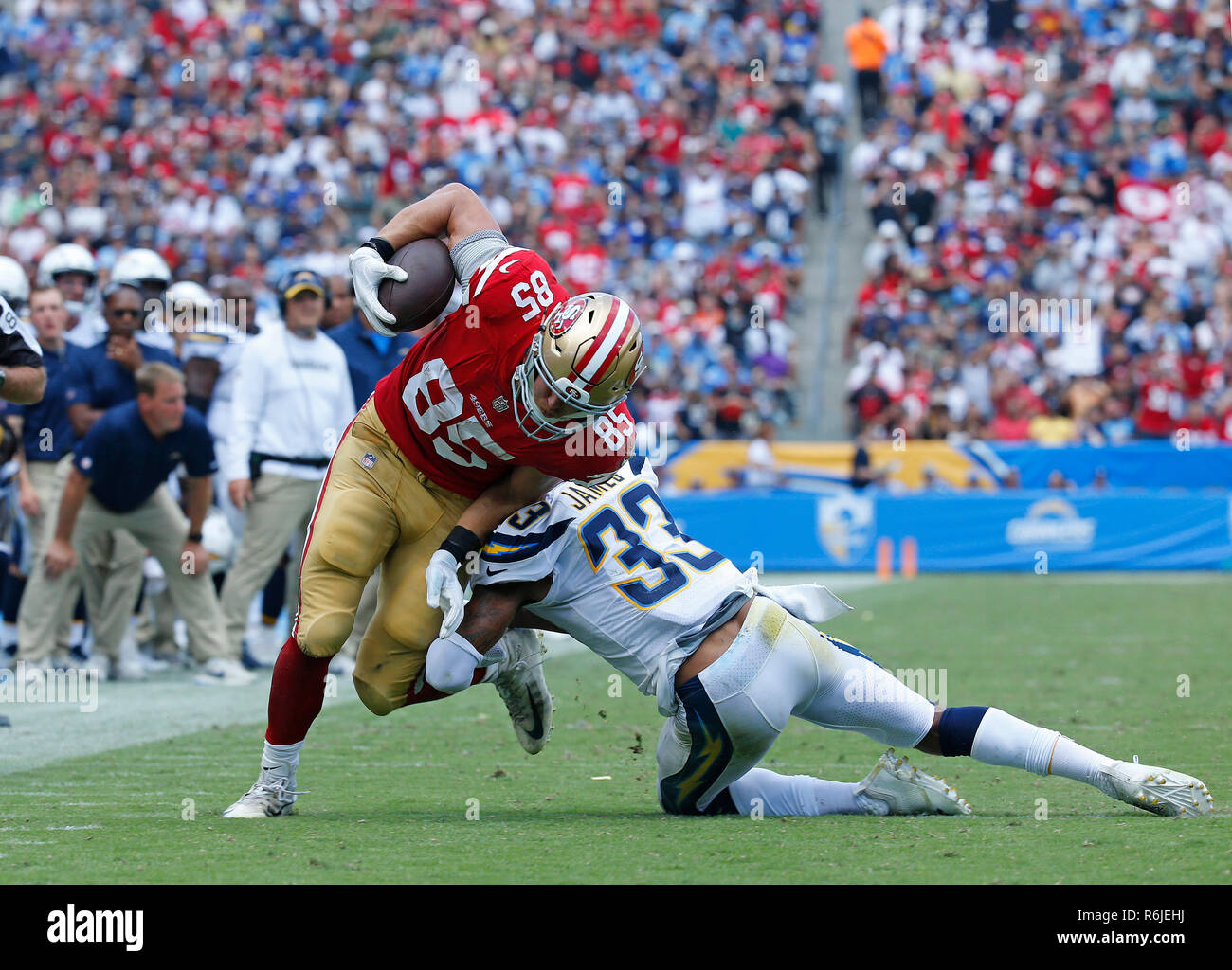 September 30, 2018 San Francisco 49ers tight end George Kittle (85) is  tackled by Los Angeles Chargers defensive back Derwin James (33) during the  football game between the San Francisco 49ers and