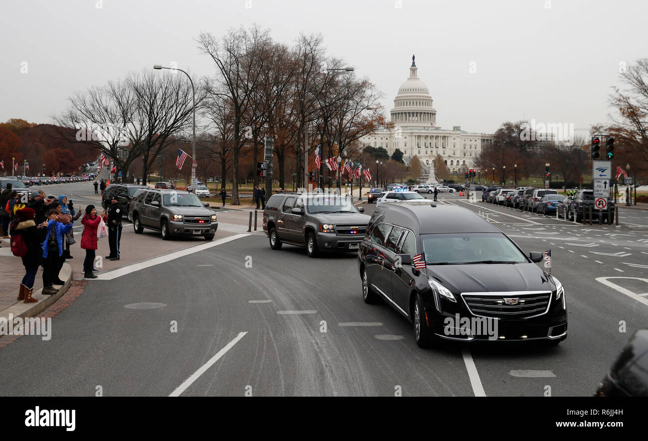 The hearse carrying the  flag-draped casket of former President George H.W. Bush is driven away from the Capitol to a State Funeral at the National Cathedral, Wednesday, Dec. 5, 2018, in Washington. Credit: Alex Brandon / Pool via CNP | usage worldwide Stock Photo