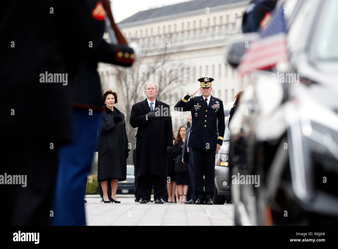 The flag-draped casket of former President George H.W. Bush is carried by a joint services military honor guard from the U.S. Capitol, Wednesday, Dec. 5, 2018, in Washington.  Credit: Alex Brandon / Pool via CNP | usage worldwide Stock Photo