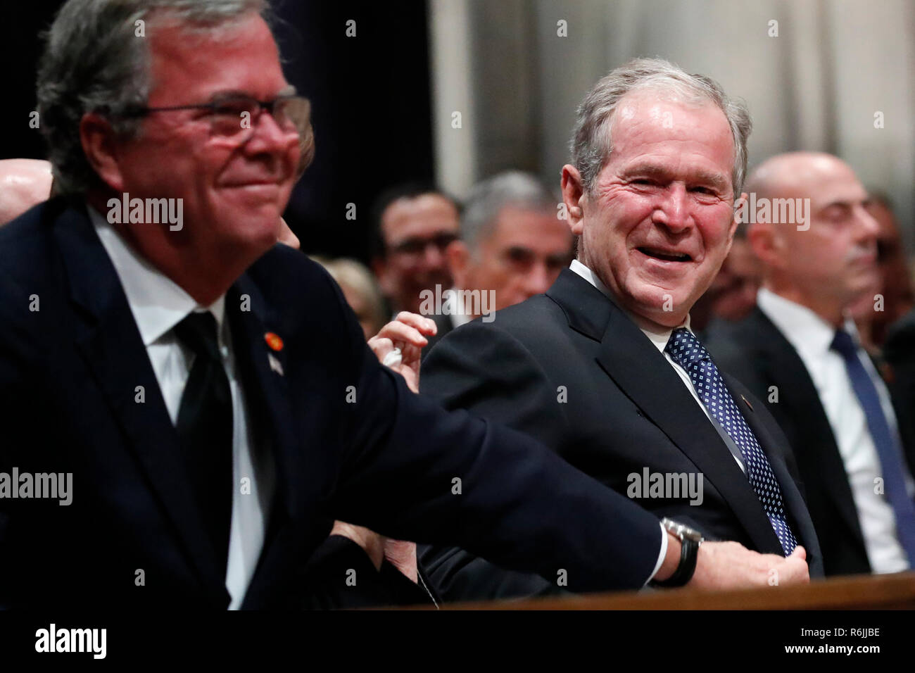 Former President George W. Bush smiles with his brother Jeb Bush at the State Funeral for their father, former President George H.W. Bush, at the National Cathedral, Wednesday, Dec. 5, 2018, in Washington.  Credit: Alex Brandon / Pool via CNP | usage worldwide Stock Photo