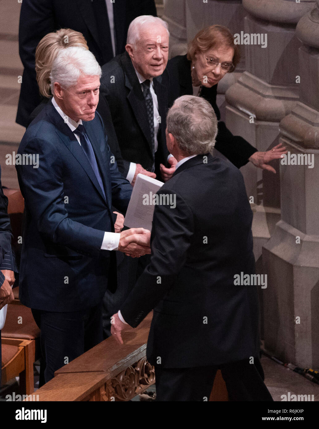 December 5, 2018 - Washington, DC, United States: Former President George W. Bush greets Bill Clinton, Hillary Clinton, Jimmy Carter and Rosalyn Carter as he arrives at the state funeral service of his father former President George W. Bush at the National Cathedral.   Credit: Chris Kleponis / Pool via CNP / MediaPunch Stock Photo