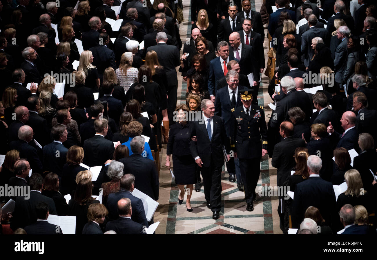 Former President George W. Bush with his wife Laura during walk behind the casket of his father former president George Herbert Walker Bush during a memorial ceremony at the National Cathedral in Washington, Wednesday,  Dec.. 5, 2018.   Credit: Doug Mills / Pool via CNP / MediaPunch Stock Photo
