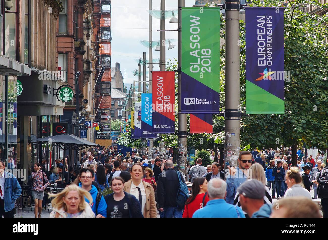 Crowded Buchanan street during the European Championships in 2018, with the event banners hanging on the lamp posts, Glasgow, UK Stock Photo