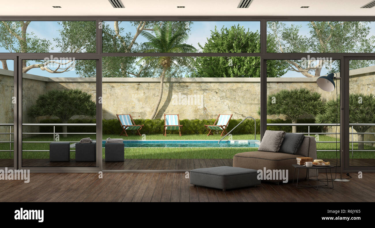 Living room of a villa with pool in the garden Stock Photo