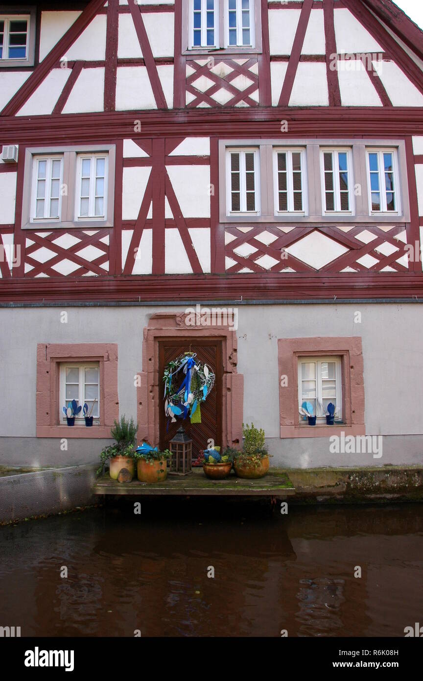 half-timbered house on the queich in annweiler Stock Photo