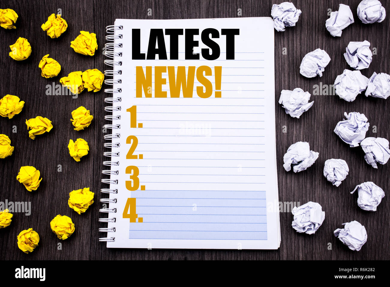 Conceptual Hand Writing Text Caption Showing Latest News Business Concept For Fresh Current New Story Written On Notepad Note Notebook Book Wooden Background With Sticky Folded Yellow And White Stock Photo