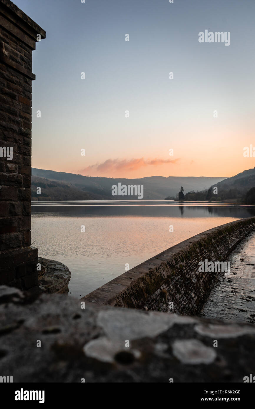 Scenic view across the Talybont Reservoir in the Brecon Beacons during sunset, Powys, Wales, UK Stock Photo