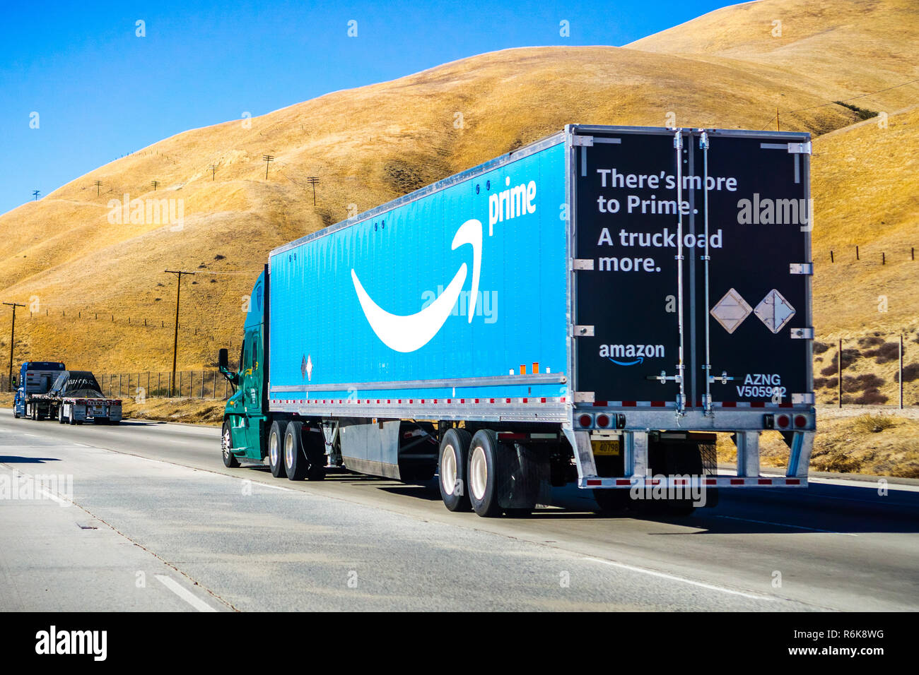 December 2, 2018 Los Angeles / CA / USA - Amazon truck driving on the interstate, the large Prime logo printed on the side Stock Photo