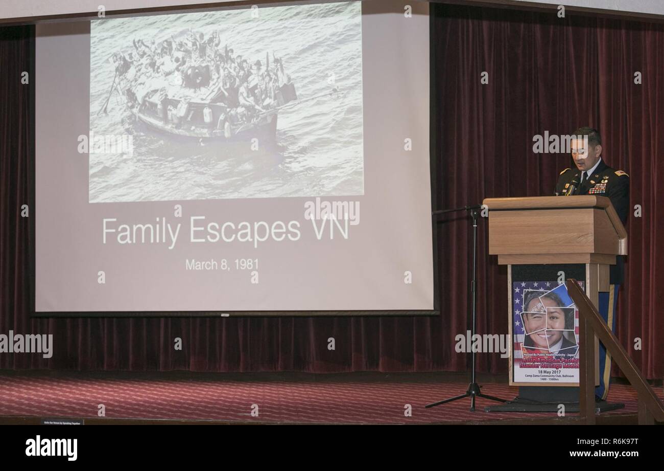 Lt. Col. Lan Dalat shares his family’s story of escape from Vietnam with an audience of community members May 18, 2017 for the Asian American Pacific Islander Heritage Month Observance at Camp Zama Community Club. Stock Photo