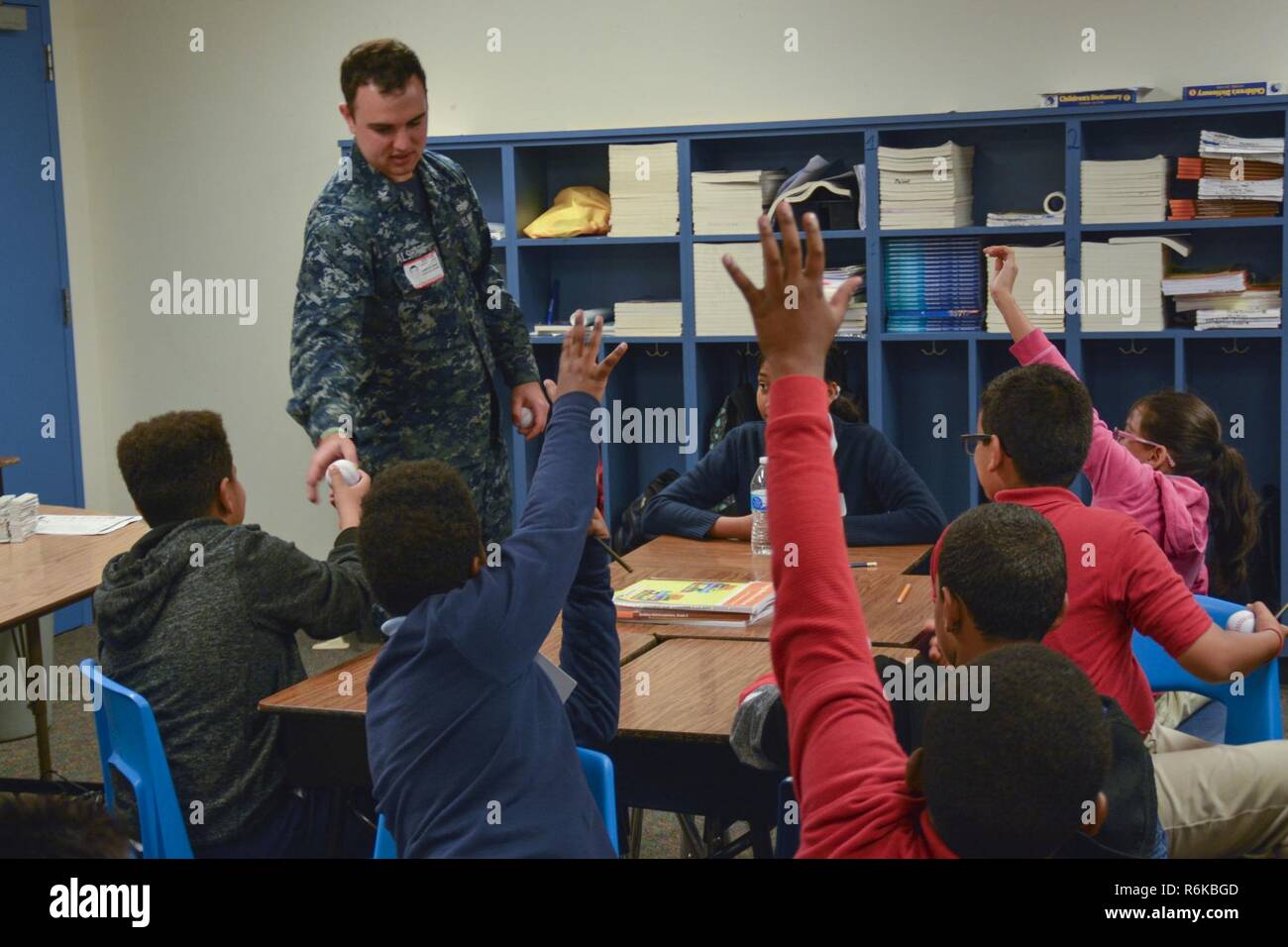 IRVING, Texas (May 19, 2017) Machinist Mate 2nd Class Adam Al Sharif, a recruiter assigned to Navy Recruiting District (NRD) Dallas, answers questions from students at Thomas Haley Elementary School during Career Day. NRD Dallas encompasses 150,000 square miles that includes Northwest Texas and Oklahoma. Stock Photo