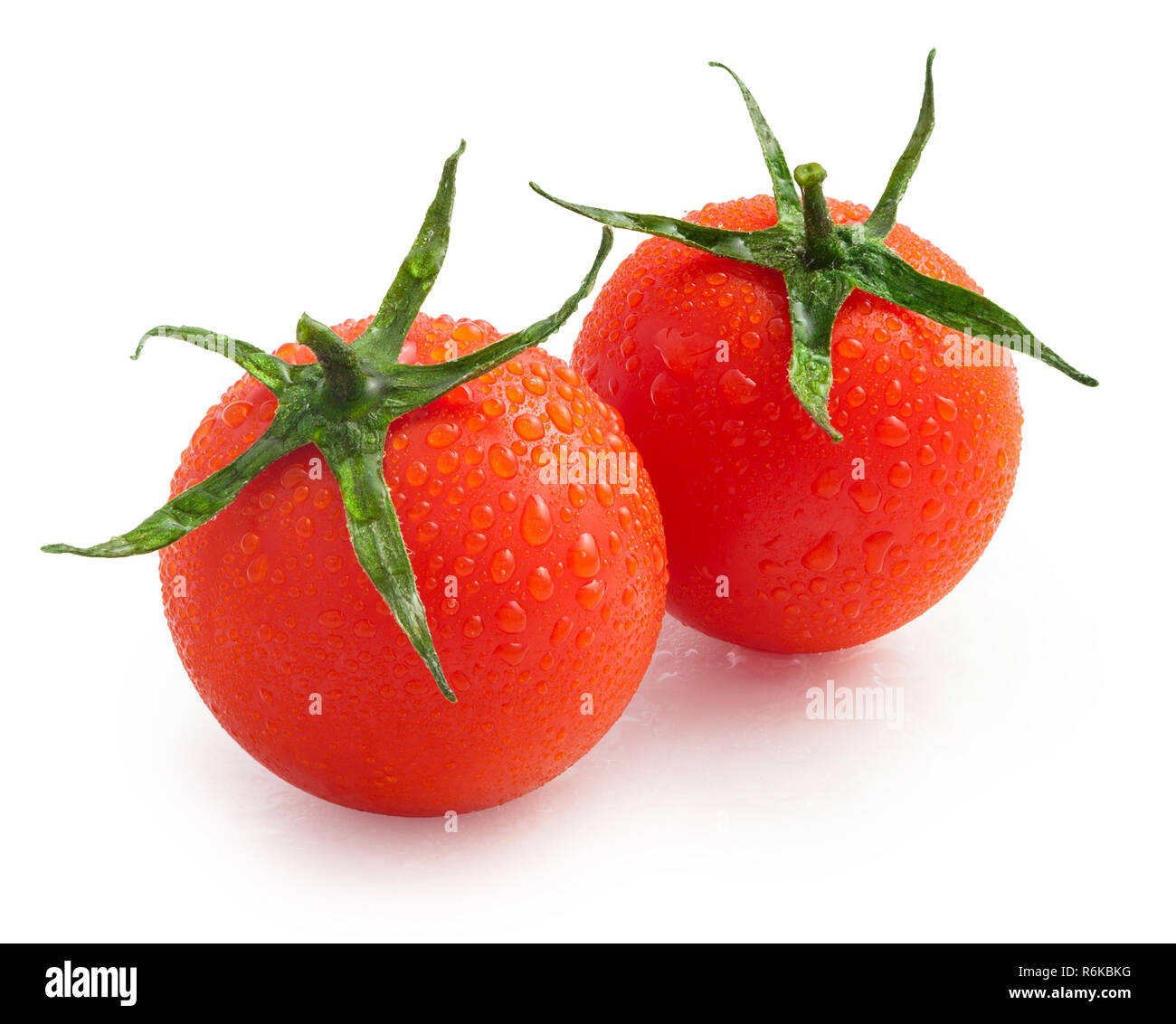 cherry tomatoes with water drops isolated on white background, with ...