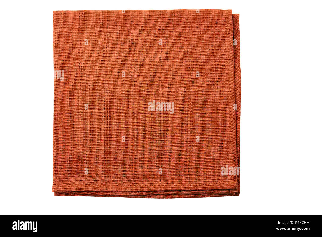 Folded natural brown textile napkin isolated on white background Stock Photo
