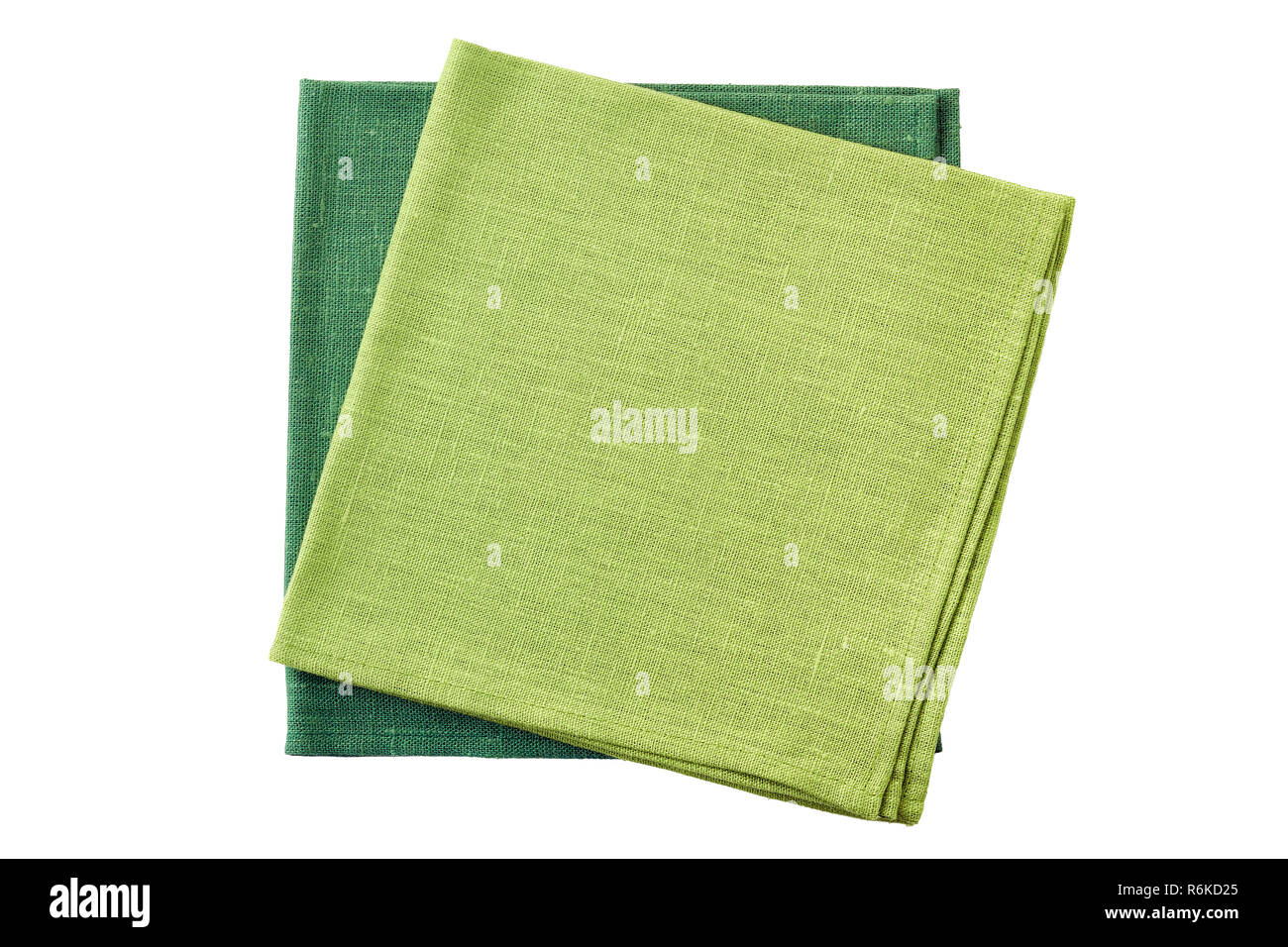 Two green folded textile napkins isolated on white background Stock