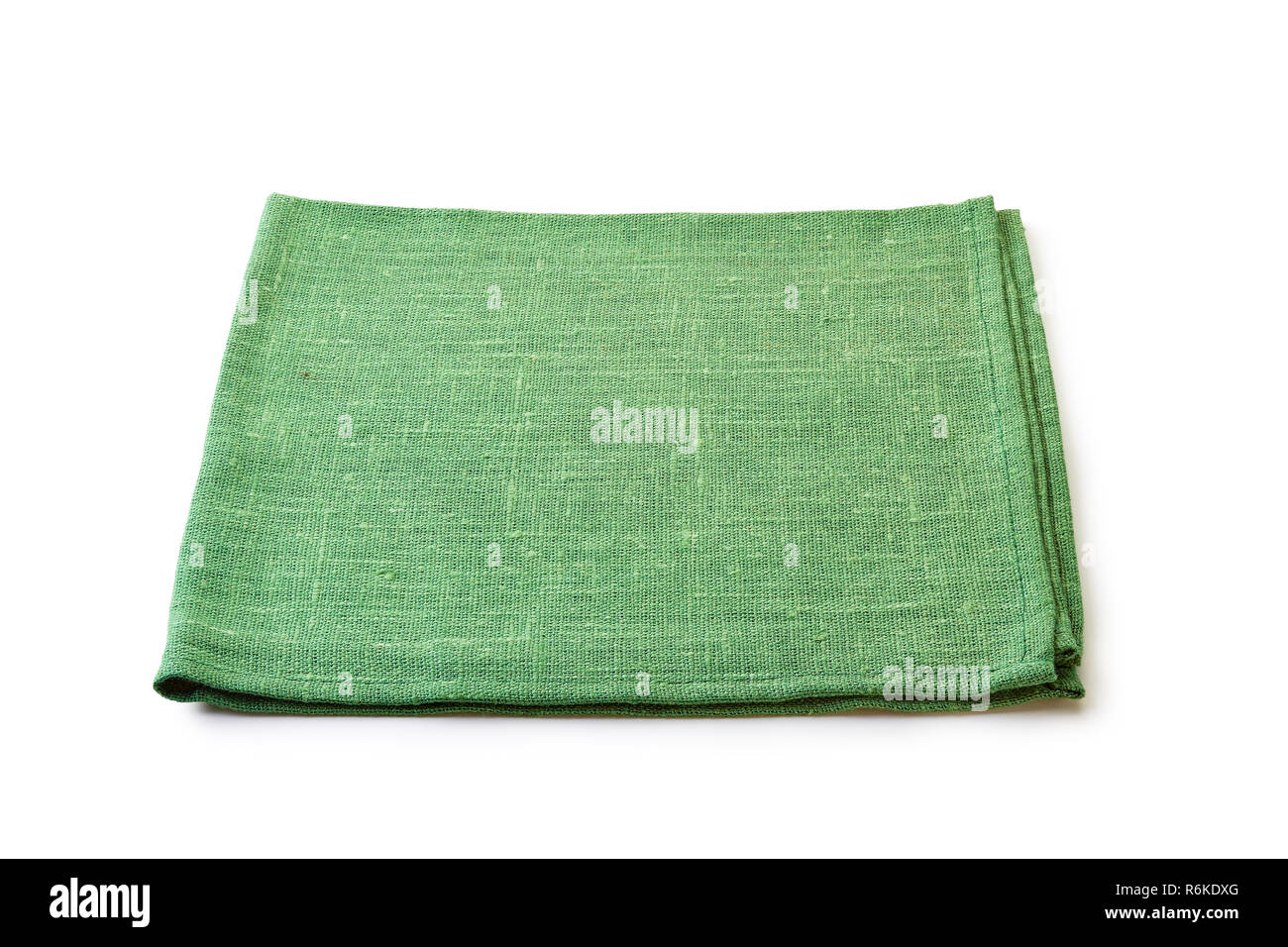 Folded green natural textile napkin on white Stock Photo Alamy