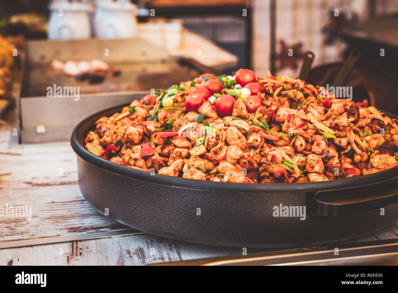 Big plate of meat ragout on the table. Street food photo Stock Photo