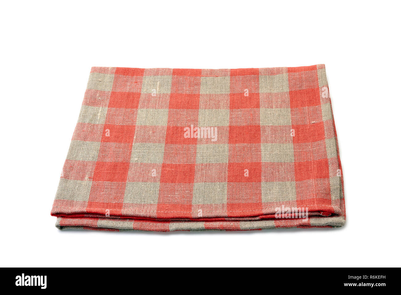 Folded red-checkered textile napkin on white background Stock Photo