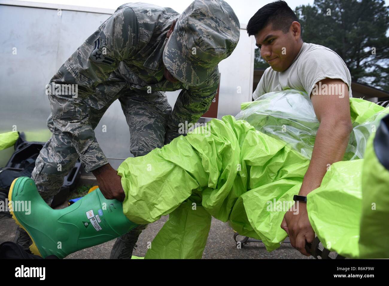 https://c8.alamy.com/comp/R6KF9W/us-air-force-airman-1st-class-jajuan-erby-left-19th-aerospace-medicine-squadron-bioenvironmental-technician-assists-us-air-force-senior-airman-velentine-orta-bartolon-19th-amds-technician-right-don-a-level-a-biohazard-may-18-2017-at-little-rock-air-force-base-ark-every-tool-in-the-bioenvironmental-arsenal-is-strategically-employed-for-the-detection-of-various-pollutants-and-radiation-in-the-environment-R6KF9W.jpg