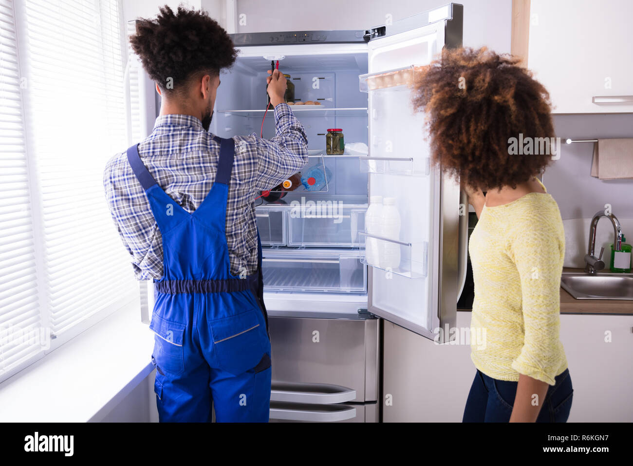 Repairman Checking Refrigerator With Digital Multimeter Stock Photo - Alamy