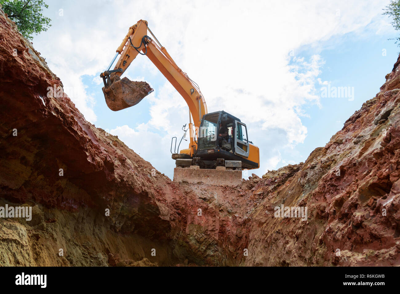 Excavator digging a trench for the pipeline. Excavation Stock Photo Alamy
