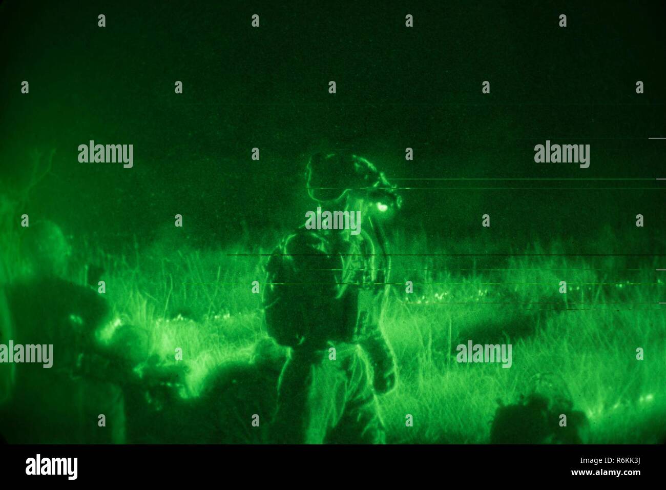 U.S. Soldiers assigned to the 1st Battalion, 506th Infantry Regiment, 1st, Brigade Combat Team, 101st Airborne Division conduct a Night Live Fire Exercise during United Accord 2017 at Bundase Training Camp, Bundase, Ghana, May 26, 2017. United Accord (formerly Western Accord) 2017 is an annual, combined, joint military exercise that promotes regional relationships, increases capacity, trains U.S. and Western African forces, and encourages cross training and interoperability. Stock Photo