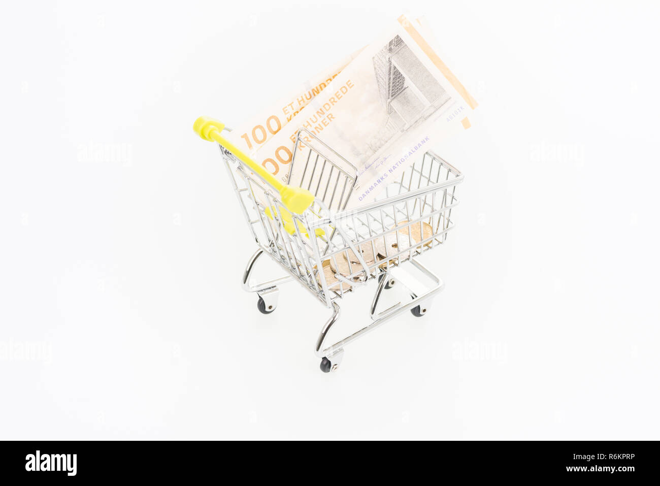 Miniature shopping cart with Danish Krone banknotes and coins Stock Photo