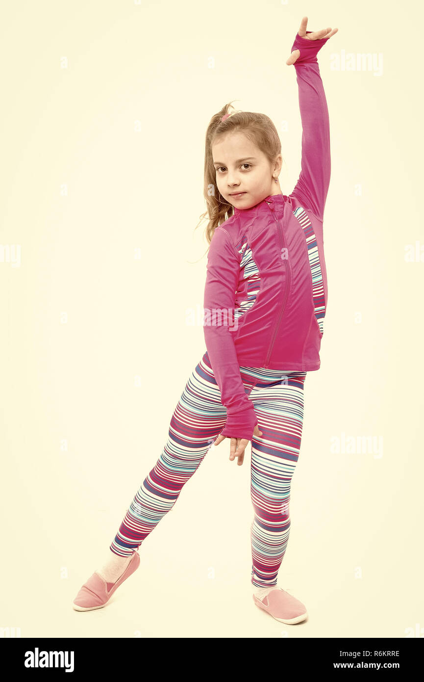 Workout of small girl isolated on white background. Sport and