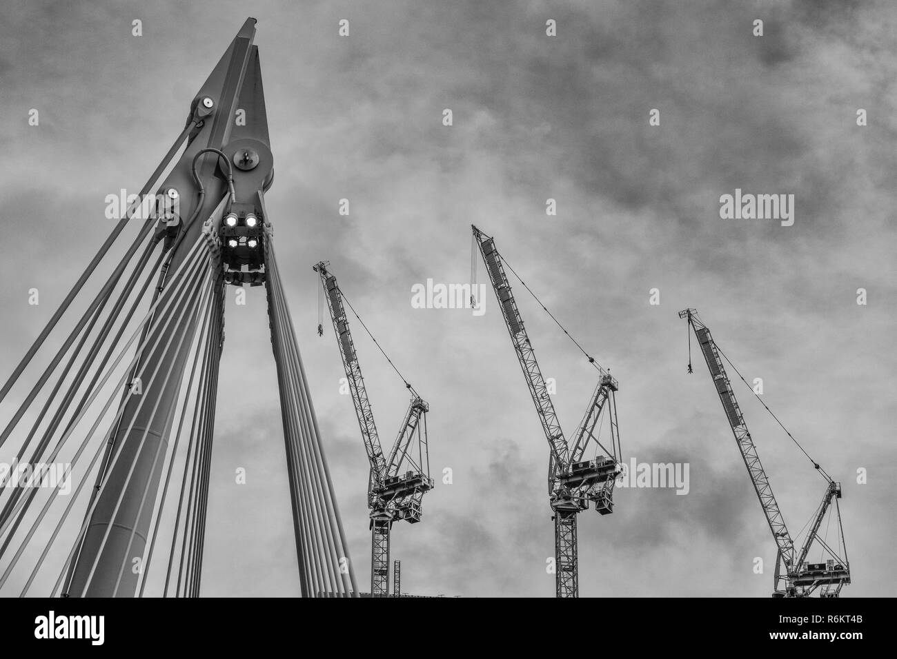 Three tower cranes Black and White Stock Photos & Images - Alamy