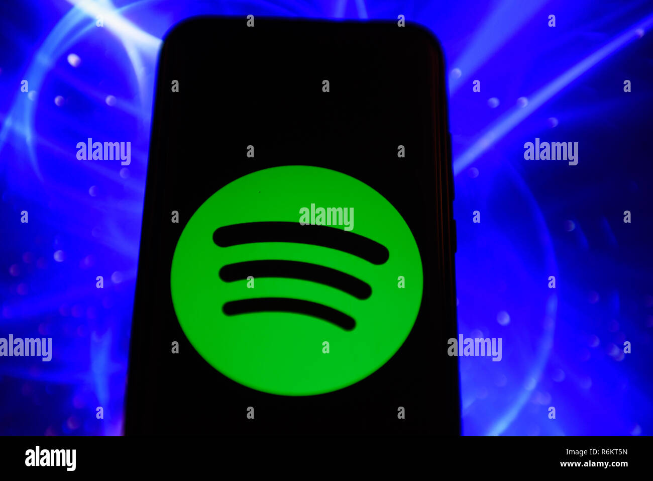 Spotify logo is seen on an android mobile phone. Stock Photo