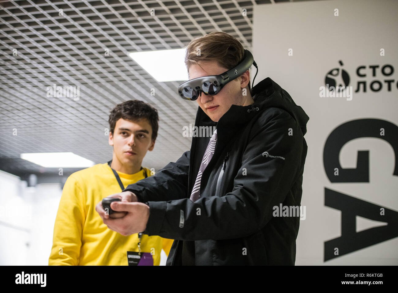 MOSCOW, RUSSIA - OCTOBER 27 2018. Man Wearing Virtual Reality Headset Playing Game Stock Photo