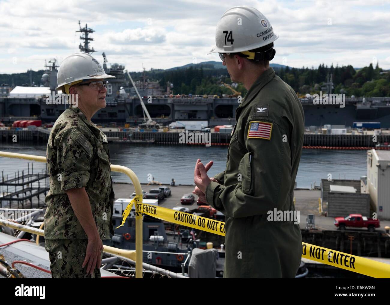 BREMERTON, Washington (May 19, 2017) Capt. Gregory Huffman, commanding officer of USS John C. Stennis (CVN 74) describes the ongoing maintenance of the flight deck to Vice Adm. Nora Tyson, commander, U.S. 3rd Fleet, during a tour of the ship. Tyson is visiting the Pacific Northwest to speak with Sailors during various all hands calls around Naval Base Kitsap and to serve as grand marshal of the 69th annual Bremerton Armed Forces Day Parade. John C. Stennis is conducting a planned incremental availability (PIA) at Puget Sound Naval Shipyard and Intermediate Maintenance Facility, during which th Stock Photo