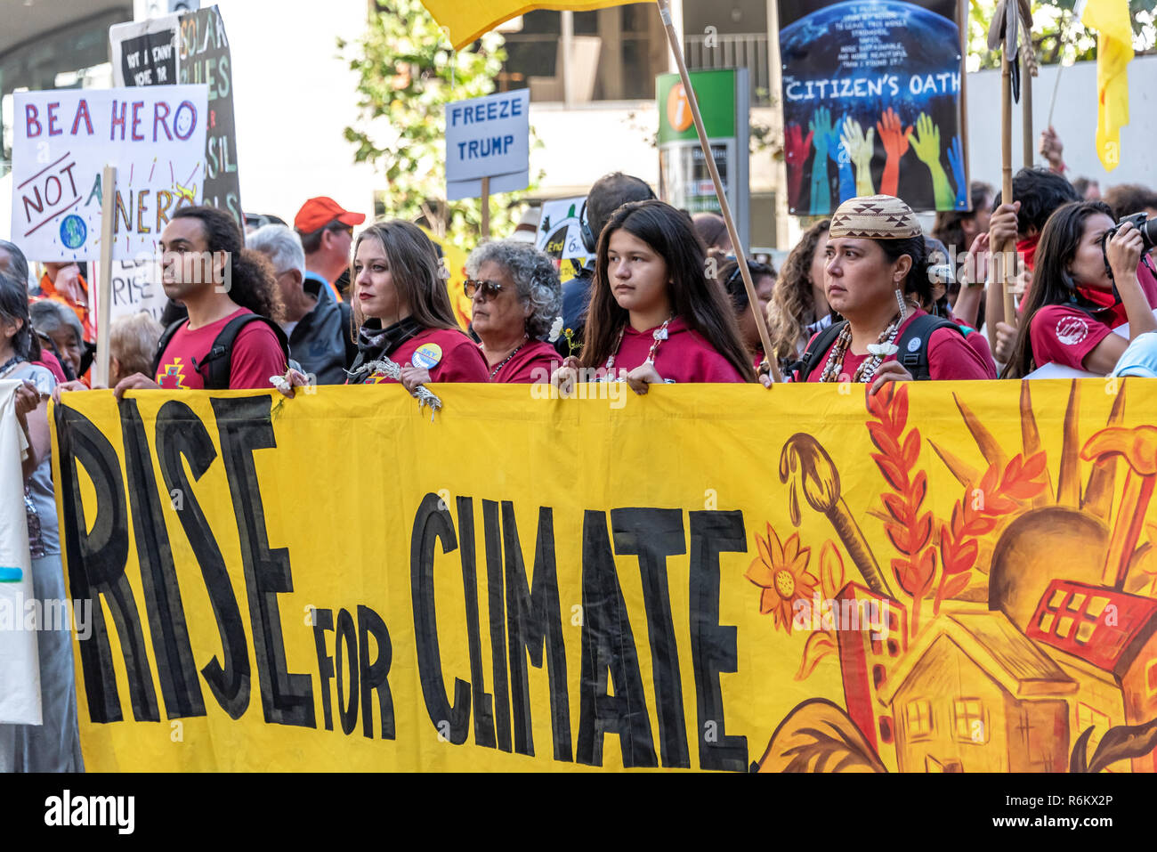 San Francisco, California, USA. 8th September, 2018. Thousands gather in San Francisco in Rise for Climate rally and march in advance of the Global Climate Action Summit to be held there September 12 to 14. A group of Native American people from the Kutzadika tribe of Mono Lake Basin hold a wide banner reading 'Rise for Climate' as they march down Market Street. Stock Photo