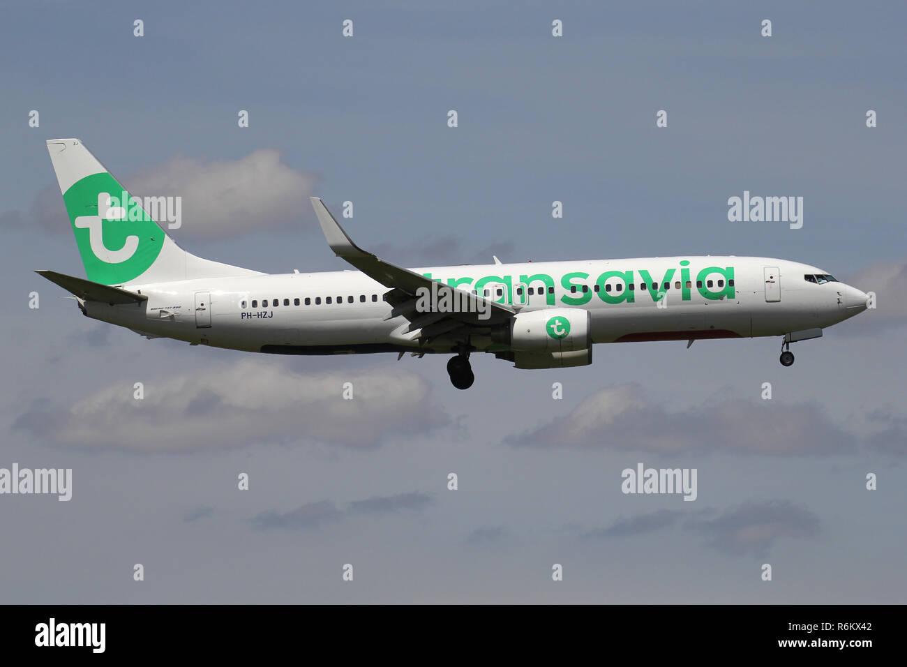 Dutch Transavia Boeing 737-800 with registration PH-HZJ on short final for runway 06 of Amsterdam Airport Schiphol. Stock Photo