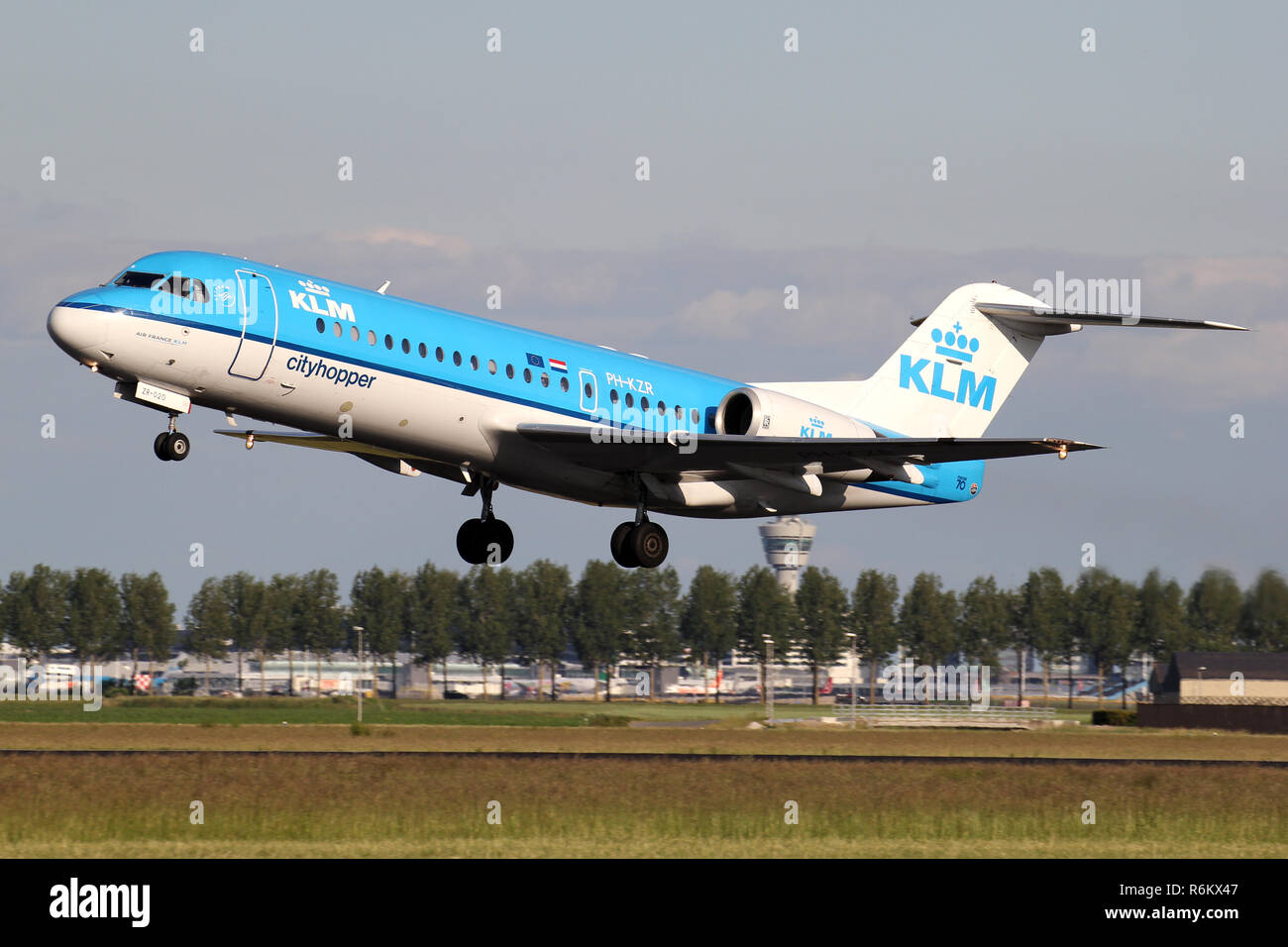 Dutch KLM Cityhopper Fokker 70 with registration PH-KZR just airborne at Amsterdam Airport Schiphol. Stock Photo