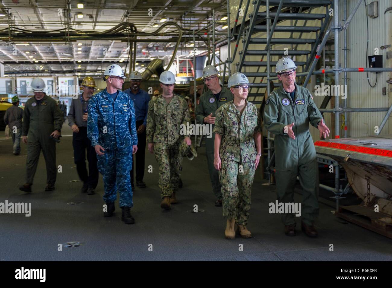 BREMERTON, Washington (May 19, 2017) Vice Adm. Nora Tyson, commander, U.S. 3rd Fleet, tours USS John C. Stennis’ (CVN 74) hangar bay during a visit to speak with Sailors. Tyson is visiting the Pacific Northwest to speak with Sailors during various all hands calls around Naval Base Kitsap and to serve as grand marshal of the 69th annual Bremerton Armed Forces Day Parade. John C. Stennis is conducting a planned incremental availability (PIA) at Puget Sound Naval Shipyard and Intermediate Maintenance Facility, during which the ship is undergoing scheduled maintenance and upgrades. Stock Photo