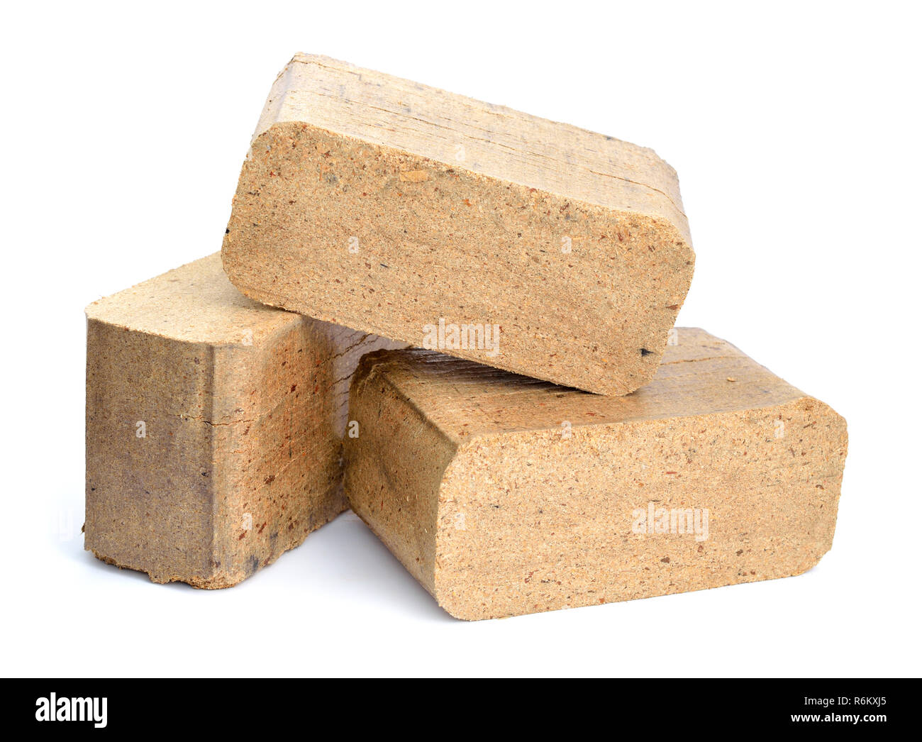 Biomass briquettes are a biofuel substitute to coal and charcoal. Isolated on white background. Stock Photo