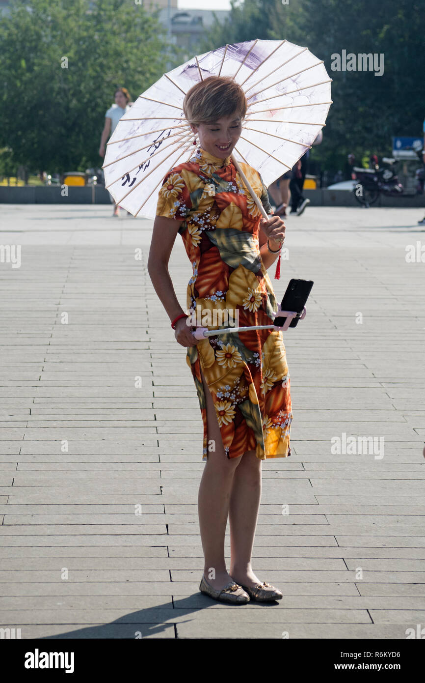 Local chinese woman with sun umbrella hi-res stock photography and images -  Alamy
