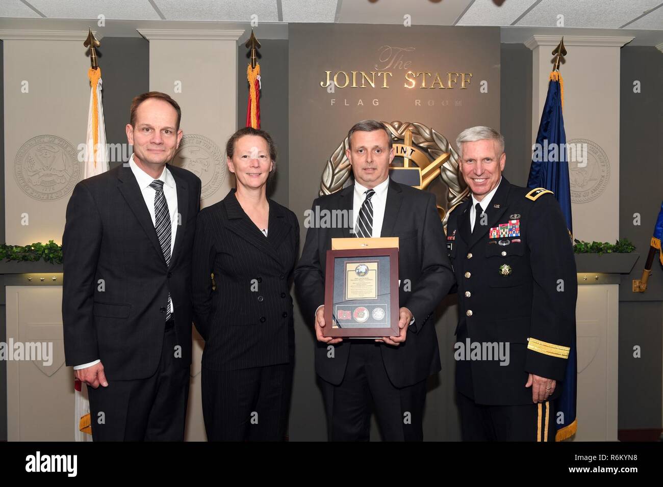 Karl F. Schneider (Left), senior career official performing the duties of the Under Secretary of the Army, host of the 2016 Lean Six Sigma excellence awards program ceremony May 18, 2017 at the Pentagon in Arlington, Va., poses with Diane Parks (Second from left), U.S. Army Corps of Engineers Nashville District chief of Operations, Tim Dunn (Third from left), Nashville District deputy chief of Operations, and Maj. Gen. Richard L. Stevens, U.S. Army Corps of Engineers deputy commanding general. Parks and Dunn accepted the Army’s Lean Six Sigma Award Program Process Improvement Project Team Exce Stock Photo