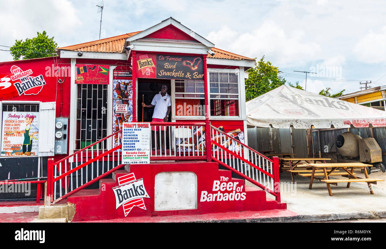 Pool hall in Bridgetown, Barbados covered with ads for Banks, a popular