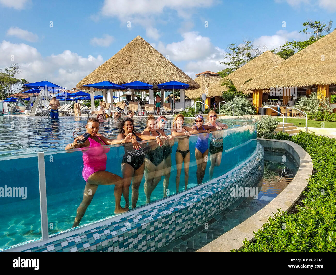 Infinity" pool with glass slide at Sandals resort in Barbados Stock Photo -  Alamy