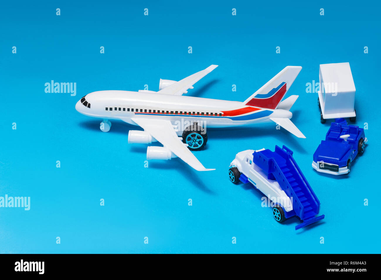 plastic toy plane on blue background Stock Photo - Alamy