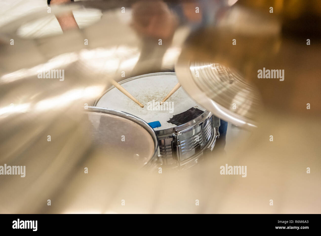 Drummer playing on drum set top view. Live music concert, band during