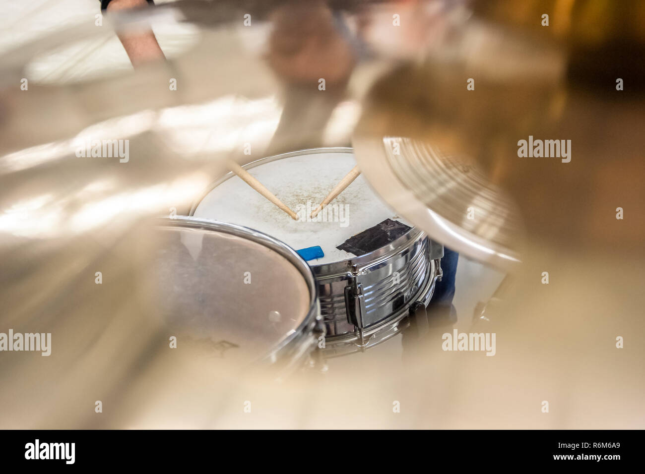 Drummer playing on drum set top view. Live music concert, band during