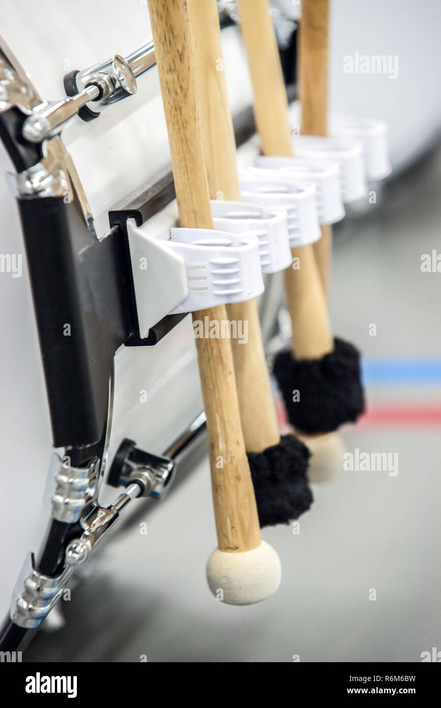 Several drumsticks mounted on a bass drum for different percussion