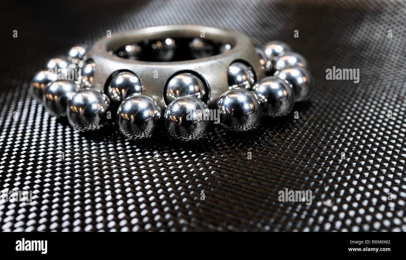 Ball bearings and wheel bearing on carbon fiber cloth Stock Photo Alamy