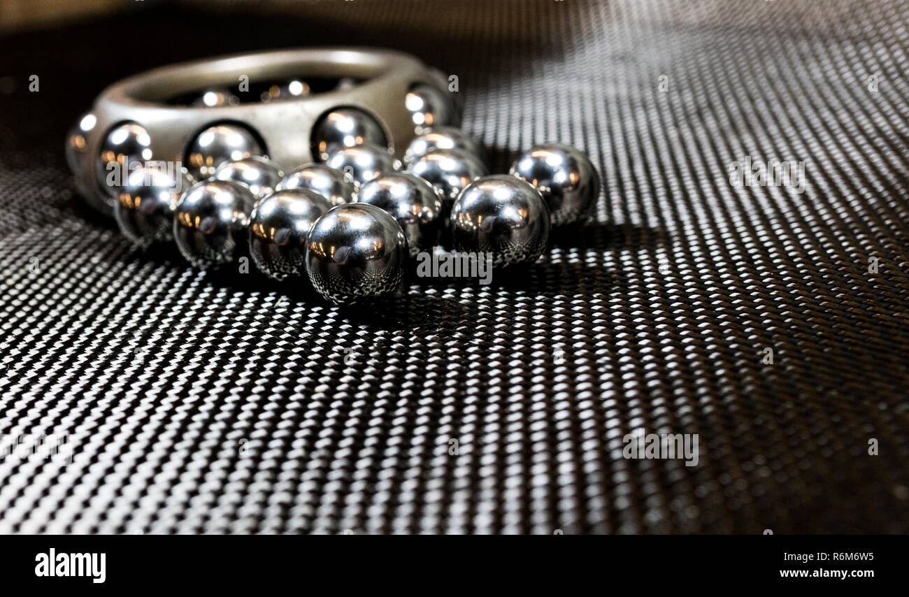 Ball bearings and wheel bearing on carbon fiber cloth 2 Stock Photo Alamy