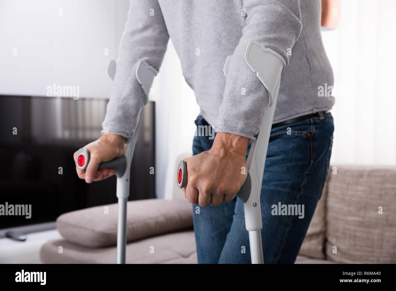 Man With Broken Leg Using Crutches Stock Photo Alamy