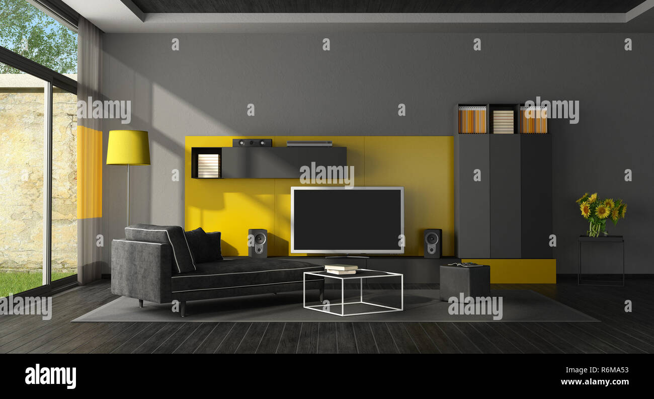 Black and yellow living room with tv set Stock Photo - Alamy