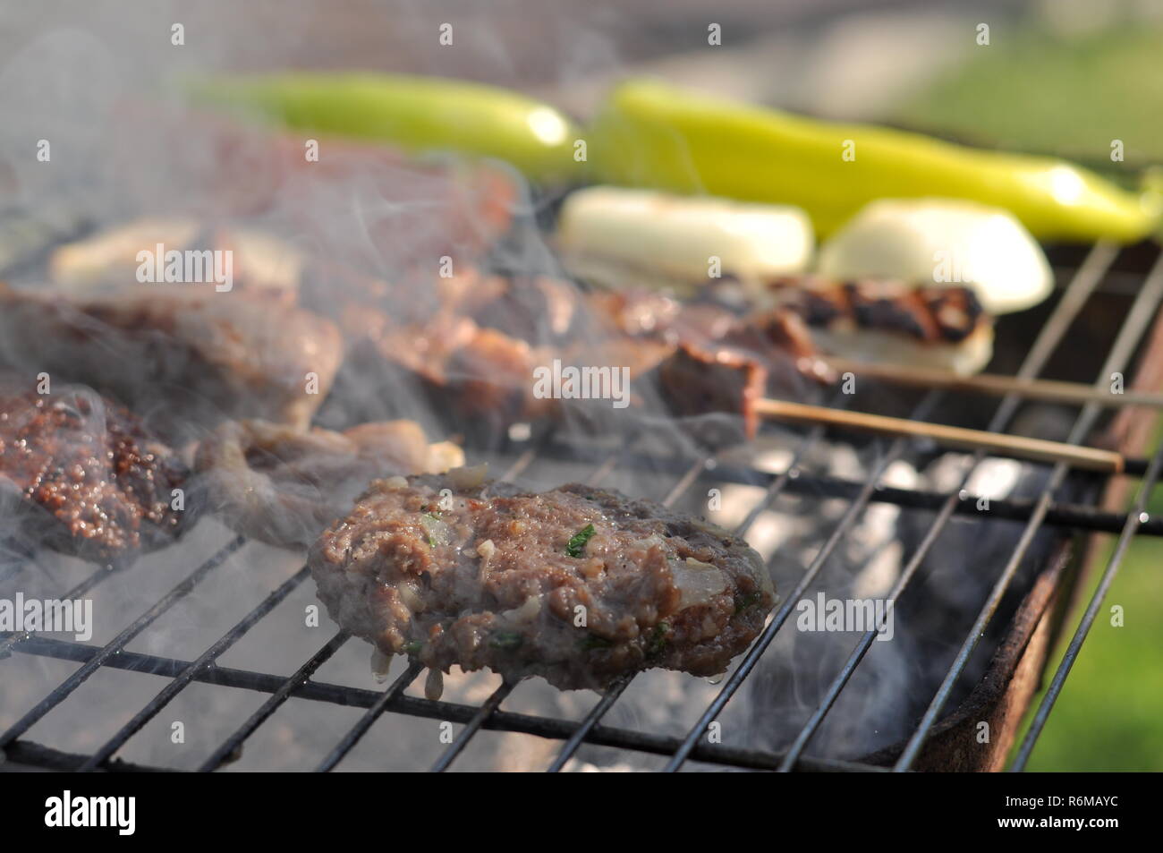 Traditional Cypriot meze and kebap barbecue party in the garden with ...